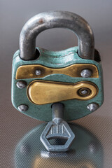 Closed old padlock with key close-up - 757563841