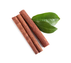 Fotobehang Cinnamon sticks and green leaves isolated on white, top view © New Africa