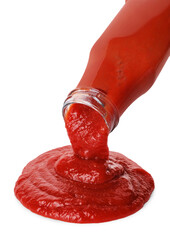 Pouring tasty ketchup from bottle isolated on white. Tomato sauce