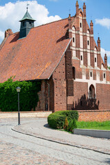 Gothic St. Lawrence Church next to 13th century Malbork Castle, medieval Teutonic fortress on the River Nogat, Malbork, Poland