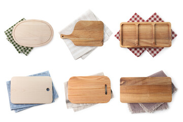Different wooden boards and napkins isolated on white, top view