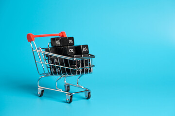 Shopping cart and cubic CO2 carbon dioxide. Greenhouse gas consumption and footprint. Calculate the...