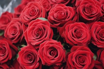 A close-up view of a sumptuous bouquet of red roses, symbolizing deep love and romantic gestures. Close-up of Lush Red Roses Bouquet