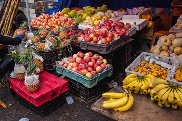 Fruits for sale on food market in historic part of Shanghai city, China