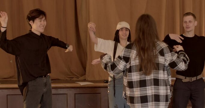 Acting skills training session, young student performers engage in various exercises and activities aimed at honing their theatrical abilities. Supportive environment for the aspiring actors.
