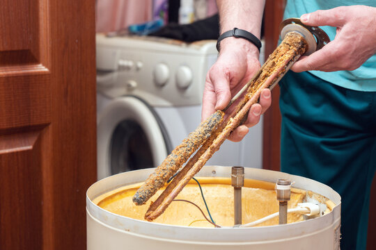 The water heating element of the boiler is covered with sediment and limescale. Boiler repair and maintenance