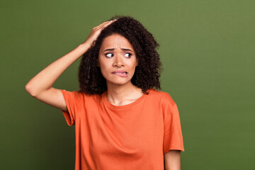 Photo portrait of pretty young girl look nervous frightened empty space wear trendy orange outfit...