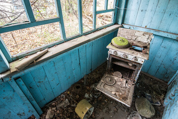 Gas cooker in old cottage in abandoned Stechanka village in Chernobyl Exclusion Zone, Ukraine - obrazy, fototapety, plakaty