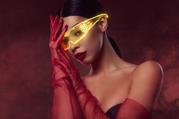Creative 3d collage of beautiful stunning girl in virtual holographic goggles over red vr background