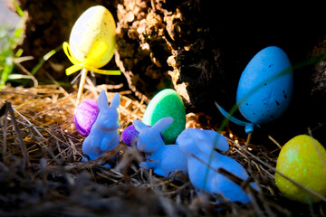 Cute Miniature Easter Bunny and Eggs Scene hiding in the the grass.