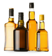 Different sorts of whiskey in glass bottles isolated on white