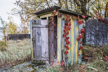 Wooden privy in abandoned Radioecology Laboratory in former fish farm in Chernobyl Exclusion Zone, Ukraine