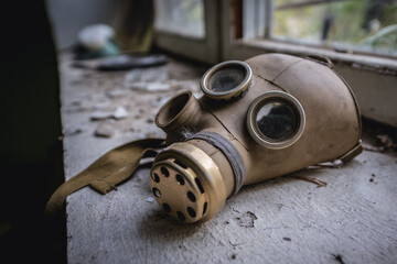 Gas mask in bandoned Radioecology Laboratory in former fish farm in Chernobyl Exclusion Zone,...