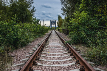 Fototapeta na wymiar Railway track near railway track near Chernobyl Nuclear Power Plant in Chernobyl Exclusion Zone, Ukraine