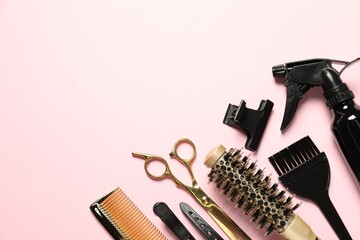 Professional hair dresser tools on pink background, flat lay. Space for text
