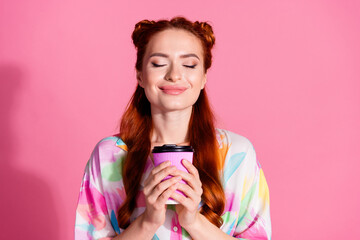 Photo of overjoyed satisfied girl with red tails dressed colorful blouse smell aromatic cappuccino...