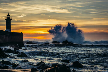 Sunset over Atlantic Ocean. View with Felgueiras Lighthouse in Porto city in Portugal