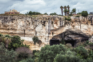 Fototapeta premium Latomia del Paradiso ancient quarry in Neapolis archaeological park of Syracuse city, Sicily Island in Italy