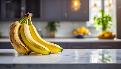 Bananas on white tabletop, kitchen blurred background. Symbolic stock photo of freshness and health