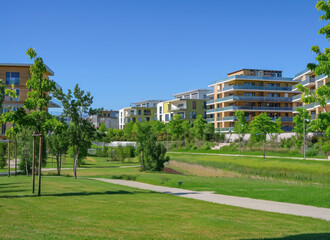 Fototapeta na wymiar the essence of urban renewal modern apartments with green spaces and communal areas clear blue sky