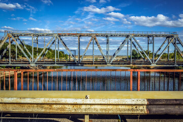 Railway bridge over canal of cooling lake in Chernobyl Nuclear Power Plant, Ukraine - obrazy, fototapety, plakaty
