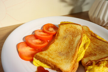 Simple breakfast menu, bread toast with egg and tomato