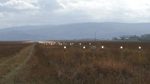 Lighting system that flashes intermittently at the end of the runway during the day. Precision Approach Path Indicator. Windy day
