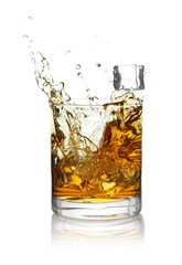 Whiskey splashing out of glass on white background