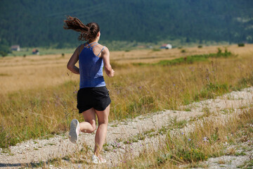 Solo Stride: Determined Athlete Woman Embarks on Fitness Journey for Marathon Preparation.