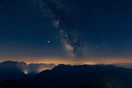 Night sky with stars and milky way over Lechtal mountains, Reutte, Ammergau Alps, Tyrol, Austria, Europe
