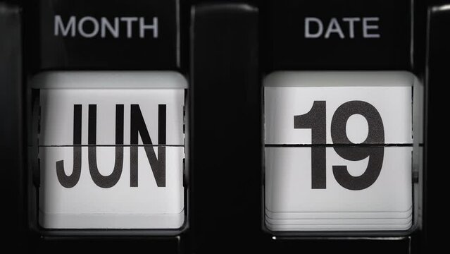 retro flip calendar with a date change from the eighteenth of June to the nineteenth of June. daily calendar with a change of days of the month. close up.