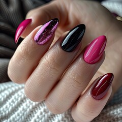 Female hand with bright nail design. Multicolored nail polish manicure.