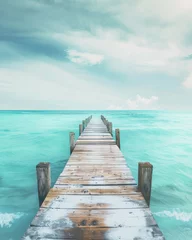 Fototapeten Beach pier with turquoise ocean © InfiniteStudio