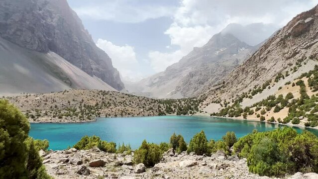 The Alaudin (Chapdara) lakes, lying at an altitude of 2800 m, are considered one of the most beautiful lakes of the Fan Mountains. Turquoise mountain lake. Pamiro-Alai. Tajikistan, Pamir 4K
