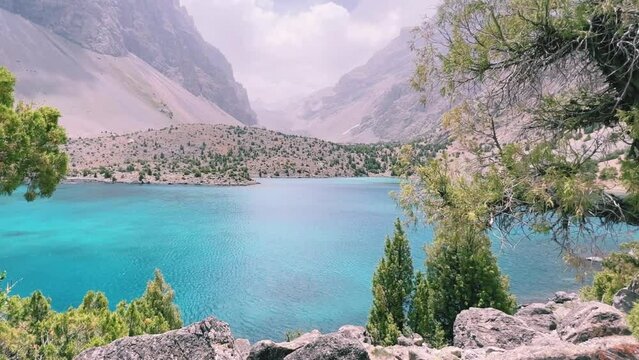 The Alaudin (Chapdara) lakes, lying at an altitude of 2800 m, are considered one of the most beautiful lakes of the Fan Mountains. Turquoise mountain lake. Pamiro-Alai. Tajikistan, Pamir 4K