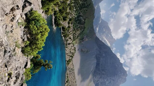 The Alaudin (Chapdara) lakes, lying at an altitude of 2800 m, are considered one of the most beautiful lakes of the Fan Mountains. Turquoise mountain lake. Pamiro-Alai. Tajikistan, Pamir 4K