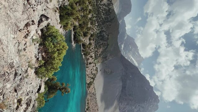 The Alaudin (Chapdara) lakes, lying at an altitude of 2800 m, are considered one of the most beautiful lakes of the Fan Mountains. Turquoise mountain lake. Pamiro-Alai. Tajikistan, Pamir 4K