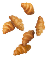 Puff pastry. Fresh croissants falling on white background