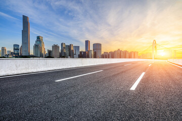 Asphalt road highway and modern city buildings at sunset in Guangzhou