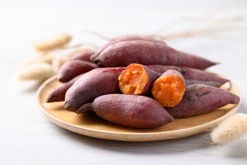 Boiled sweet potato on wooden plate