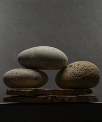 minimalistic composition of stones for the podium. podium of stones for the presentation of perfumery, cosmetics, medicine, jewelry products