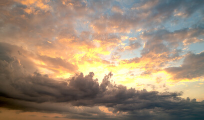 Sunrise background. Dramatic sunset background. Sky with clouds in Sunrise sky light background. Sunrise with clouds in various shapes background. Calm Sunrise.