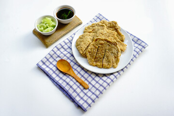 Pempek Kulit, traditional food from South Sumatra, Indonesia. This fish-based food is very popular. Served with cuko sauce and cucumber slices. Top view