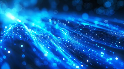 Abstract blue glowing light background with fiber optic waves and bokeh lights