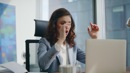 Desperate woman manager looking laptop shocked by business loss office close up.