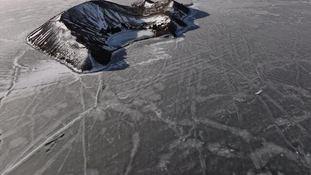 Aerial video over National Iceland Thingvellir in a snowy winter.