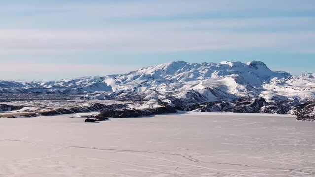 Aerial video over National Iceland Thingvellir in a snowy winter.