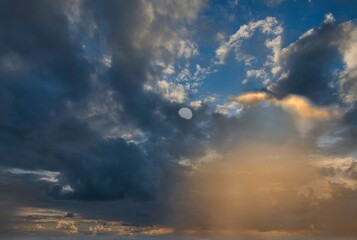 Fight at dusk between the moon and the retreating sun