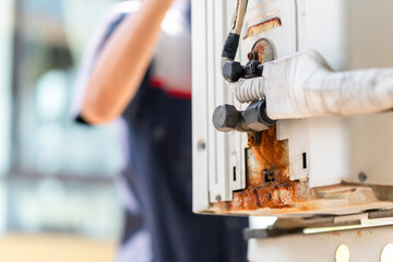 Air conditioner technician checking leaks in conditioning systems, Repairman service for repair and...