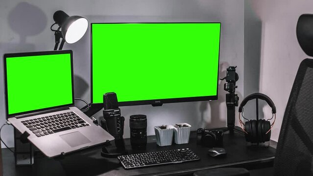 Computer desktop with mock-up green screen white background in office, Zoom shoulder view.